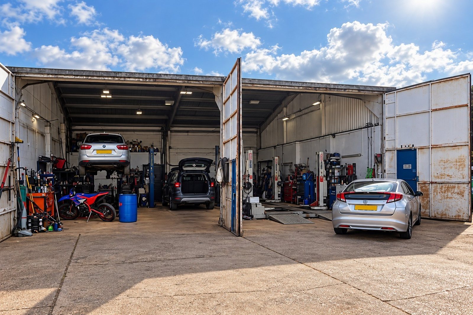 The P&J Tuning workshop bays with the doors open