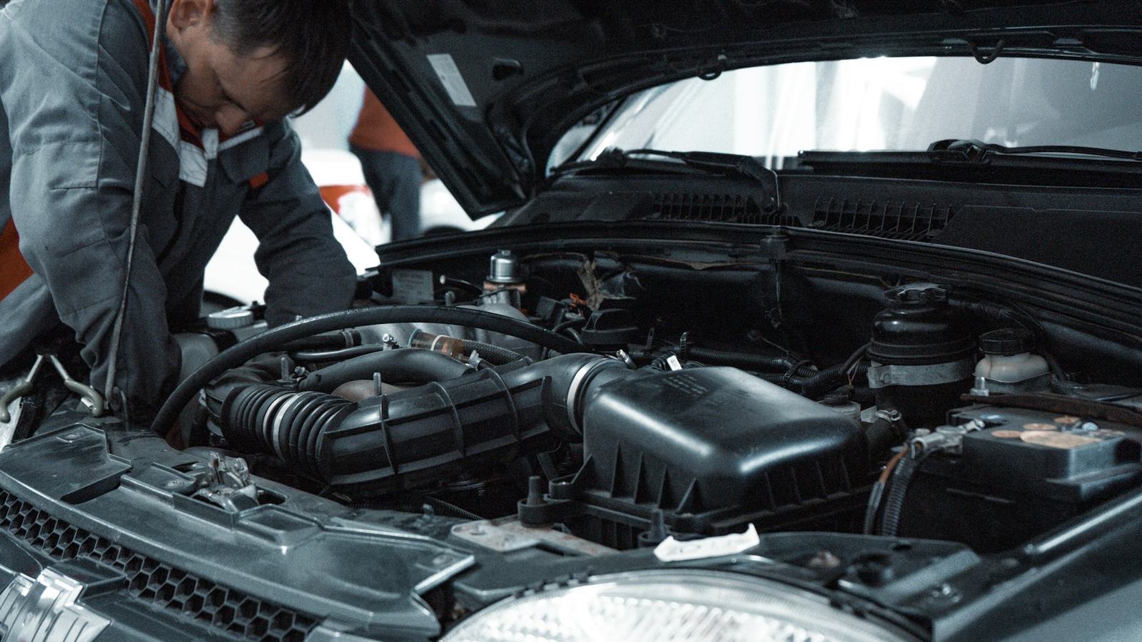 A technician checking an engine