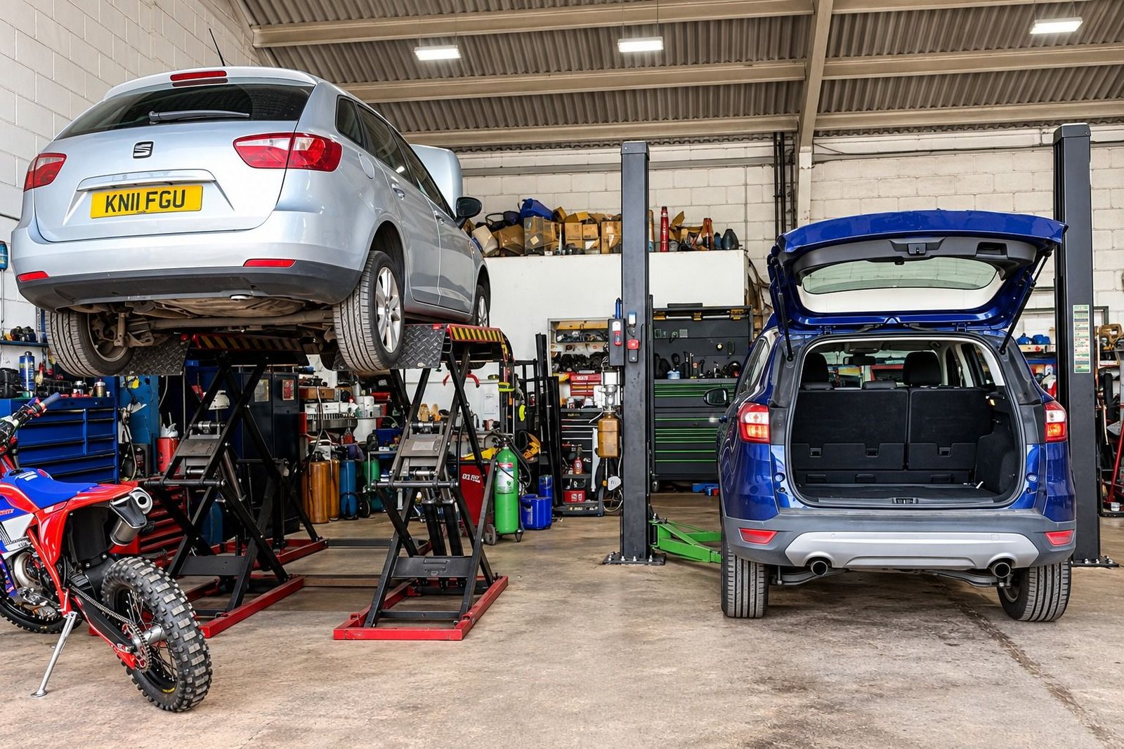 Cars being worked on inside the workshop